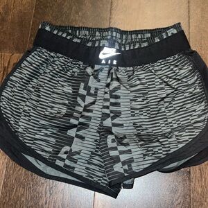 Grey and Black Nike running shorts.
